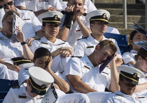 Naval Academy Midshipmen wait for the start of the U.S. Naval Academy Graduation and Commissioning Ceremony at the Naval Academy in Annapolis, Maryland on May 25, 2018. Photo by Kevin Dietsch\/