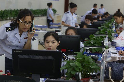 Chinese government employees assist customers at Shenyang\