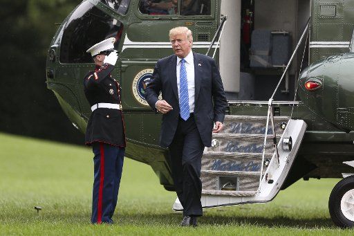 President Donald Trump walks from Marine One to the White House after returning from Kansas City, Missouri on July 24, 2018 in Washington, DC. Photo by Oliver Contreras\/