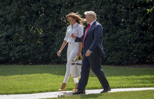 First Lady Melania Trump and U.S President Donald Trump walk towards Marine One en route to Joint Base Andrews at the White House on July 27, 2018 Washington, DC, as the President and First Lady leave for the weekend in Bedminster, New Jersey. Photo by Tasos Katopodis\/