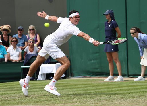 Canadian Milos Raonic plays a backhand in his match versus Australian John Millman on the third day of the 2018 Wimbledon championships, London on July 4, 2018. Photo by Hugo Philpott\/