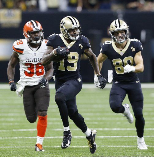 New Orleans Saints wide receiver Ted Ginn (19) goes 42 yards as Austin Carr (80) provides protection with under a minute left in the game at the Mercedes-Benz Superdome in New Orleans September 16, 2018. Defending on the play is Cleveland Browns defensive back T.J. Carrie (38). Photo by AJ Sisco\/