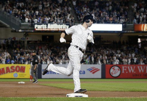 New York Yankees Neil Walker hits a 3-run home run in the 7th inning against the Boston Red Sox at Yankee Stadium in New York City on September 18, 2018. Photo by John Angelillo\/
