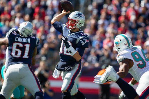 New England Patriots quarterback Tom Brady (12) throws a pass in the first quarter against the Miami Dolphins at Gillette Stadium in Foxborough, Massachusetts on September 30, 2018. Photo by Matthew Healey\/
