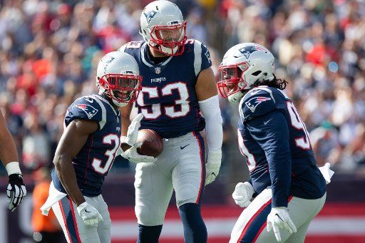 New England Patriots linebacker Kyle Van Noy (53) celebrates a fumble recover with cornerback Jason McCourty (30) defensive tackle Malcom Brown (90) in the second quarter against the Miami Dolphins at Gillette Stadium in Foxborough, Massachusetts on September 30, 2018. The Patriots defeated the Dolphins 38-7. Photo by Matthew Healey\/
