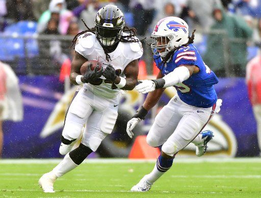 Baltimore Ravens running back Alex Collins (34) runs against the Buffalo Bills in the first quarter at M&T Bank Stadium in Baltimore, Maryland on September 9, 2018. Photo by Kevin Dietsch\/