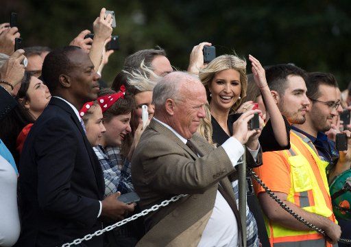 Ivanka Trump, reacts as rotor wash from Marine One hits the crowd as President Donald Trump departs the White House for a rally in Florida, on October 31, 2018 in Washington, D.C. Photo by Kevin Dietsch\/