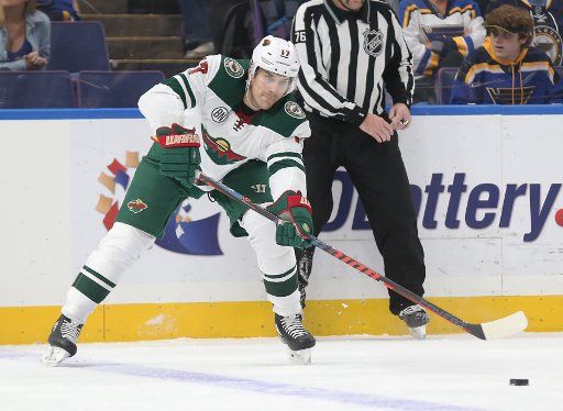 Minnesota Wild Marcus Foligno passes the puck against the St. Louis Blues during the first period at the Enterprise Center in St. Louis on November 11, 2018. Photo by Bill Greenblatt\/