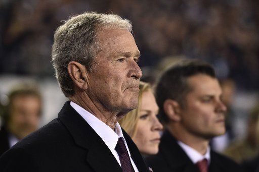 Former president George Bush stands on the sidelines prior to an NFL football game between the Philadelphia Eagles and the Dallas Cowboys at Lincoln Financial Field in Philadelphia on Nov. 11, 2018. Photo by Derik Hamilton\/