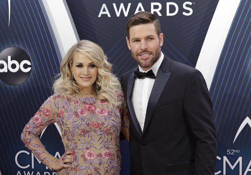 Carrie Underwood and husband Mike Fisher arrive on the red carpet at the 52nd Annual Country Music Association Awards on November 14, 2018 at Bridgestone Arena in Nashville. Photo by John Angelillo\/