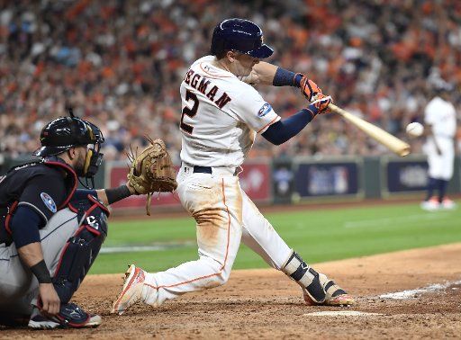 Houston Astros third baseman Alex Bregman hits a solo home run against the Cleveland Indians during the seventh inning in American League Divisional Series game two at Minute Maid Park on October 6, 2018 in Houston. Houston leads the series with Cleveland 1-0. Photo by Trask Smith\/