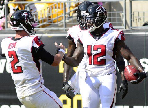 Atlanta Falcons wide receiver Mohamed Sanu (12) celebrates his touchdown with Atlanta Falcons quarterback Matt Ryan (2) in the second quarter at Heinz Field in Pittsburgh on October 7, 2018. Photo by Archie Carpenter\/