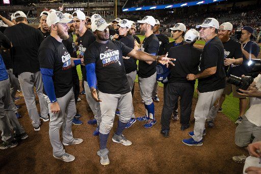 The Los Angeles Dodgers celebrate defeating the Atlanta Braves during the National League Division Series Game 4 at Suntrust Park in Atlanta, October 8, 2018. The Dodgers won 6-2 and will advance to the National League Championship Series. Photo by Paul Abell\/