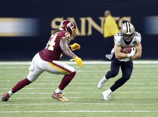 New Orleans Saints wide receiver Austin Carr (80) takes a Drew trees pass for 10 yards against the Washington Redskins at the Mercedes-Benz Superdome in New Orleans October 8, 2018. Defending on the play is Redskins linebacker Mason Foster (54). Photo by AJ Sisco\/