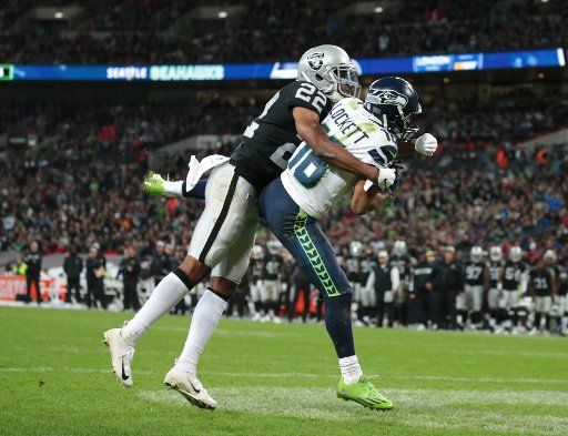 Seattle Seahawks wide receiver Tyler Lockett scores a touchdown in the NFL International Series match against the Oakland Raiders at Wembley Stadium, London on Sunday October 14, 2018. Seattle Seahawks beat Oakland Raiders 27-3. Photo by Hugo Philpott\/