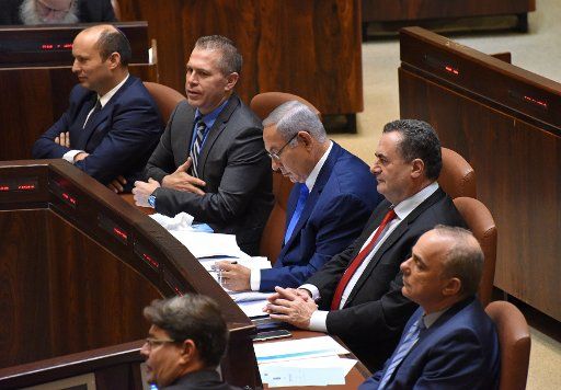 Israeli Prime Minister Benjamin Netanyahu looks at his speech during the opening session of the Israeli Knesset, the Parliament, in Jerusalem, Israel, October 15, 2018. Photo by Debbie Hill \/