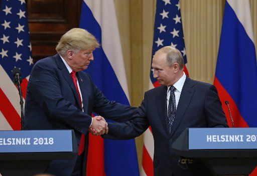 U.S. President Donald Trump (L) shakes hands with Russian President Vladimir Putin during a joint press conference at the Presidential Palace in Helsinki, Finland, on July 16, 2018. Prior to the conference, President Trump met with President Putin to discuss a variety of subjects including election meddling, the war in Syria and the North Korean threat. Photo by David Silpa\/
