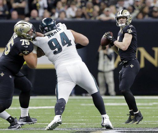 New Orleans Saints quarterback Taysom Hill, right, throws against the Philadelphia Eagles during the divisional round of the NFC playoffs at the Mercedes-Benz Superdome in New Orleans on January 13, 2019. The Saints defeated the Eagles 20-14. Photo by AJ Sisco\/