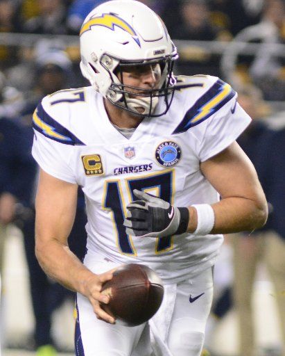 Los Angeles Chargers quarterback Philip Rivers (17) hands off the ball in the first quarter against the Pittsburgh Steelers at Heinz Field in Pittsburgh on December 2, 2018. Photo by Archie Carpenter\/
