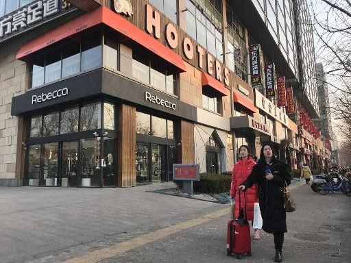 U.S.-based Hooters restaurant closes in Beijing on February 21, 2019. When the Beijing branch opened in 2007, Hooters girls from the U.S. were sent to train petite Chinese women in Hooters Waitressing 101. Despite a loyal expat clientele, the restaurant struggled with attracting local diners. Photo by Stephen Shaver\/