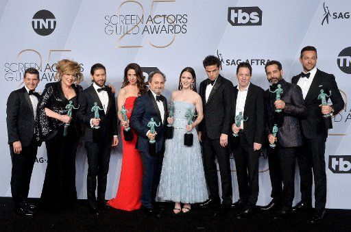 (L-R) Joel Johnstone, Caroline Aaron, Michael Zegen, Marin Hinkle, Kevin Pollak, Rachel Brosnahan, Luke Kirby, Brian Tarantina, Tony Shalhoub, and Zachary Levi appear backstage with the award for Outstanding Performance by an Ensemble in a Comedy Series for \