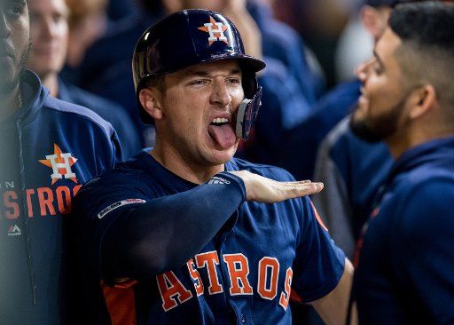 Houston Astros third baseman Alex Bregman celebrates in the dugout after scoring a run against the Oakland Athletics in the 1st inning at Minute Maid Park in Houston on April 7, 2019. Photo by Trask Smith\/