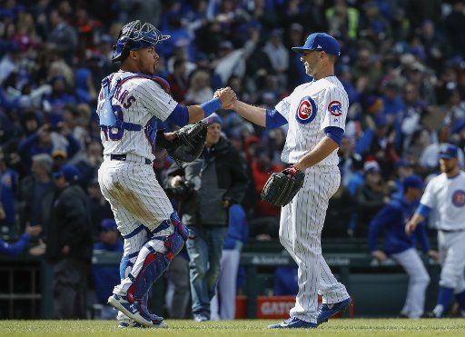 Chicago Cubs relief pitcher Brandon Kintzler celebrates with catcher Willson Contreras after defeating the Los Angeles Angels at Wrigley Field on April 12, 2019 in Chicago. Photo by Kamil Krzaczynski\/