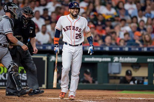 Robinson Chirinos of the Houston Astros winces after being hit by a pitch in a game against the Chicago White Sox in the 3rd inning at Minute Maid Park in Houston on May 22, 2019. Photo by Trask Smith\/