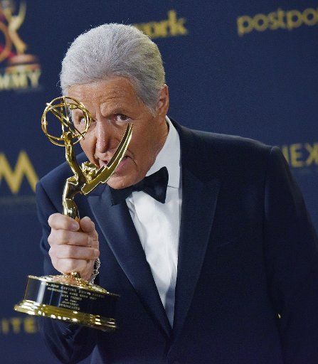 Alex Trebek holds up his Daytime Emmy for Outstanding Game Show Host backstage in the press room at the 46th Annual Daytime Emmy Awards held at the Pasadena Civic Auditorium in Pasadena, California on May 5, 2019. Photo by Chris Chew\/