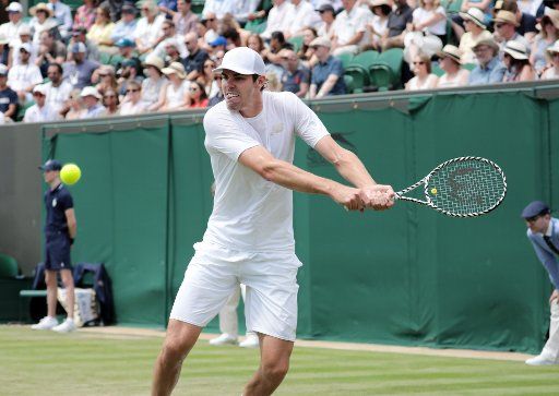 American Reilly Opelka in action against Swiss Stan Wawrinka in the second round match at Wimbledon on Wednesday, July 3, 2019. Photo by Hugo Philpott\/