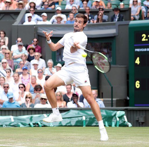 Argentinian Guido Pella returns the ball against South African Kevin Anderson in the third round match at Wimbledon on Friday, July 5, 2019. Photo by Hugo Philpott\/