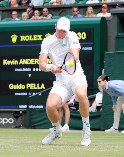 South African Kevin Anderson returns the ball in his third round match against Argentinian Guido Pella at Wimbledon on Friday, July 5, 2019. Photo by Hugo Philpott\/