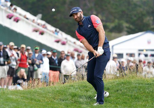 Dustin Johnson chips onto the 3rd green during round 1 of the 2019 U.S. Open at Pebble Beach Golf Links on June 13, 2019 in Pebble Beach, California. Photo by Kevin Dietsch\/