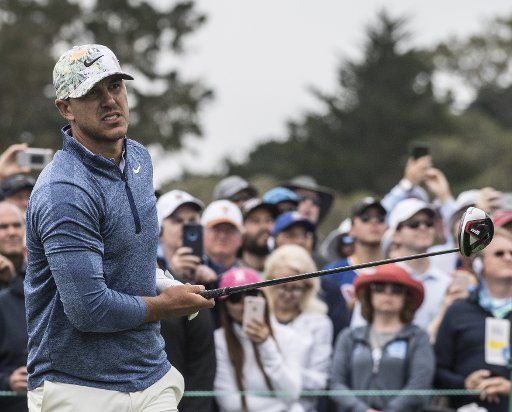 Brooks Koepka watches his shot off the 10th tee on day one at the U.S. Open in Pebble Beach, California on June 13, 2019. Photo by Terry Schmitt\/