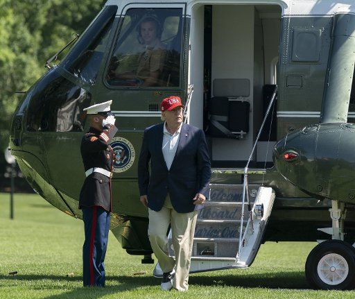 After a trip to Camp David and a stop at his golf course in Sterling, Virginia, U.S. President Donald J. Trump returns to the White House in Washington, DC on June 23, 2019. Photo by Chris Kleponis\/
