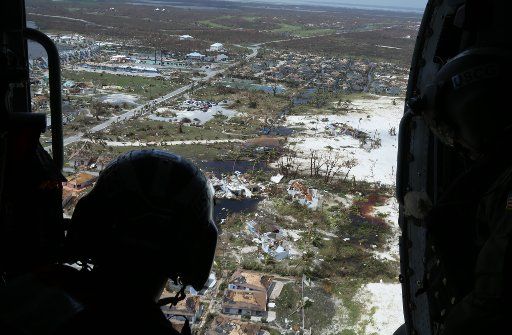 Petty Officer 2nd Class Mike Lewis observes the damages in support of search and rescue and humanitarian aid in the Bahamas on September 4, 2019. The Coast Guard is supporting the Bahamian National Emergency Management Agency and the Royal Bahamian Defense Force, who are leading search and rescue efforts in the Bahamas. Photo by Seaman Erik Villa Rodriguez\/U.S. Coast Guard\/