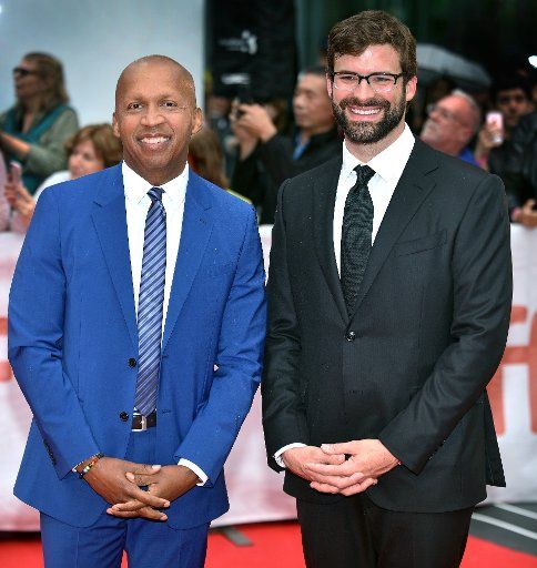 Social justice activist Bryan Stevenson (L) and screenwriter Andrew Lanham arrive for the world premiere of \