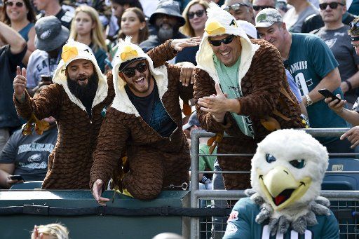Philadelphia Eagles fans take a photo with Eagles mascot Swoop during the second half against the Washington Redskins at Lincoln Financial Field in Philadelphia on Sept. 8, 2019. The Eagles won 32-27. Photo by Derik Hamilton\/