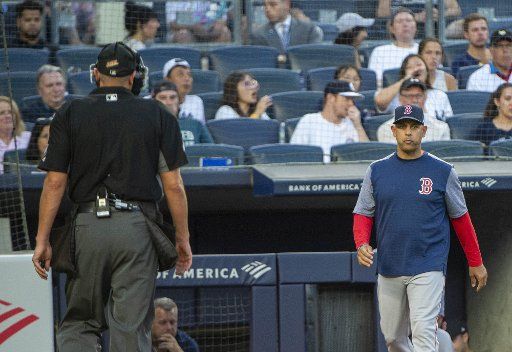 Boston Red Sox manager Alex Cora (20) walks out of the dugout to talk with home plate official in the 1st inning at Yankee Stadium in New York City on Friday, August 2, 2019. Photo by Howard Simmons\/