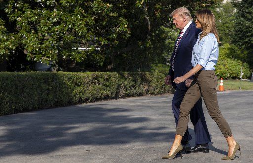 U.S. President Donald Trump and First lady Melania Trump walk to the White House after arriving on Marine One in Washington, DC on Sunday, August 4, 2019. Photo by Tasos Katopodis\/