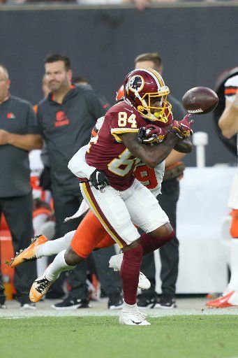 Washington Redskins Davin Kidsy Jr. has the ball knocked away by Cleveland Browns safety Terrance Mitchell in the first half in Cleveland, Ohio on Thursday, August 8, 2019. Photo by Aaron Josefczyk\/