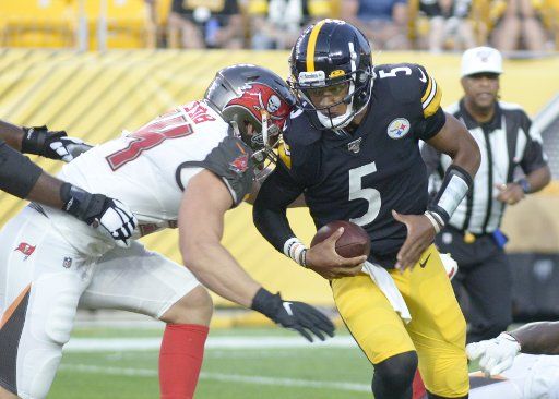 Tampa Bay Buccaneers linebacker Carl Nassib (94) sacks Pittsburgh Steelers quarterback Joshua Dobbs (5) during the second quarter of the preseason game at Heinz Field in Pittsburgh on August 9, 2019. Photo by Archie Carpenter\/
