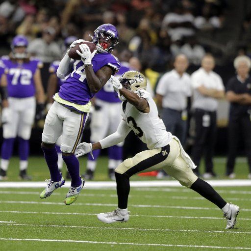 Minnesota Vikings wide receiver Stefon Diggs (14) snags a pass in front of New Orleans Saints free safety Marcus Williams (43) in the first quarter at the Louisiana Supedome in New Orleans on August 9, 2019. Photo by AJ Sisco\/