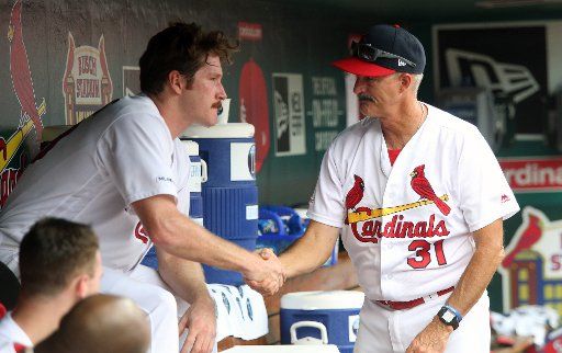 St. Louis Cardinals starting pitcher Miles Mikolas talks with pitching coach Mike Maddux after coming out of the game against the Pittsburgh Pirates in the fifth inning at Busch Stadium in St. Louis on Sunday, August 11, 2019. Photo by Bill Greenblatt\/