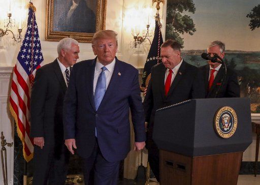 US President Donald Trump spoke about Syria in the Diplomatic Reception Room as US Vice President Mike Pence and US Secretary of State Mike Pompeo look on at the White House Washington, DC, October 23, 2019. President Donald Trump announced on Wednesday the United States would be lifting sanctions on Turkey, hailing the success of a ceasefire along its border with Syria. Photo by Tasos Katopodis\/