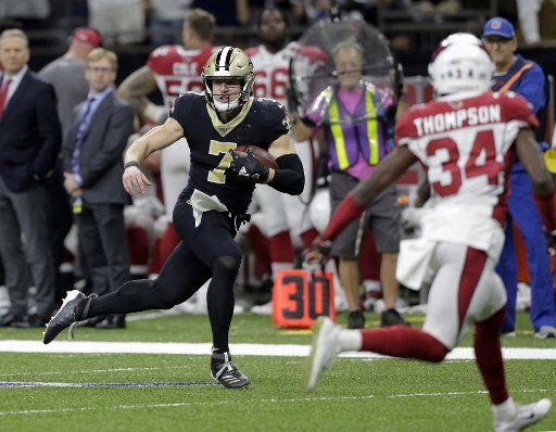 New Orleans Saints quarterback Taysom Hill (7) takes aDrew Brees pass for 36 yards against the Arizona Cardinals at the Mercedes-Benz Superdome in New Orleans on Sunday, October 27, 2019. Photo by AJ Sisco\/