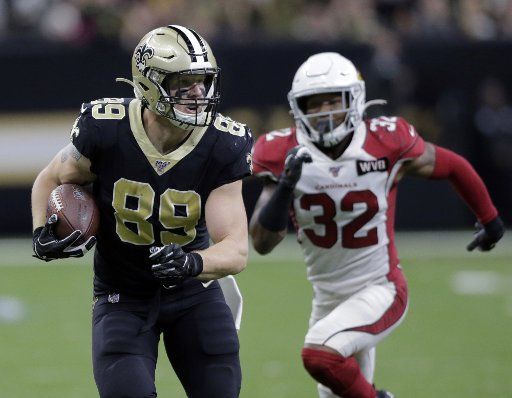 New Orleans Saints tight end Josh Hill (89) out runs Arizona Cardinals strong safety Budda Baker (32) for 29 yards at the Mercedes-Benz Superdome in New Orleans on Sunday, October 27, 2019. Photo by AJ Sisco\/