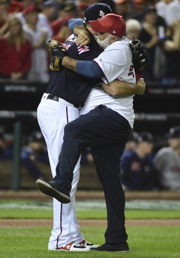 Jose Andres, celebrity chef and vocal critic of President Donald Trump, greets Washington Nationals Ryan Zimmerman after throwing out the ceremonial first pitch at Game 5 of the World Series between the Washington Nationals and Houston Astros at Nationals Park in Washington D.C. on Sunday, October 27, 2019. President Trump is expected to be in attendance at the game. Photo by Kevin Dietsch\/