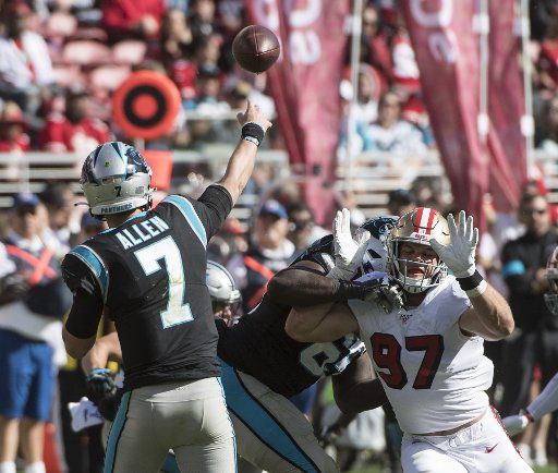 Carolina Panthers quarterback Kyle Allen (7) pressured by San Francisco 49ers defensive end Nick Bosa (97) in the second quarter at Levi\