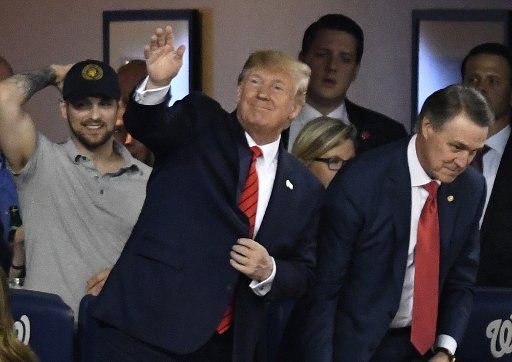 U.S. President Donald Trump waves as he attends Game 5 of the World Series between the Washington Nationals and Houston Astros at Nationals Park in Washington D.C. on Sunday, October 27, 2019. Photo by Pat Benic\/